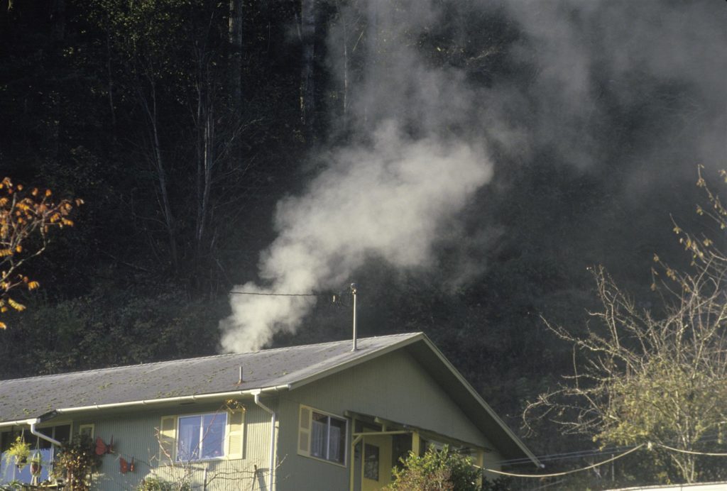 smoke emanating from a small house