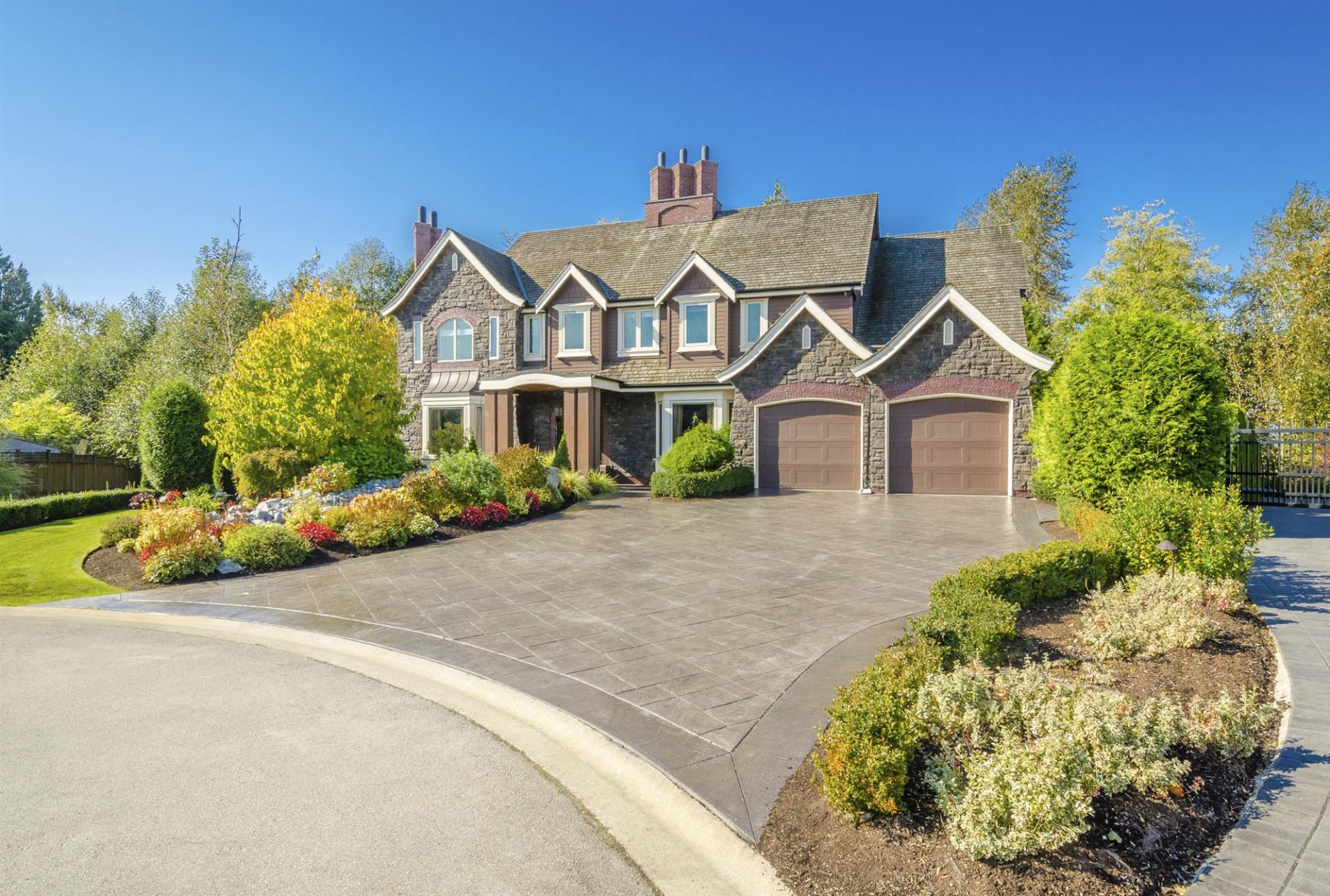 luxury suburban house with a green lawn