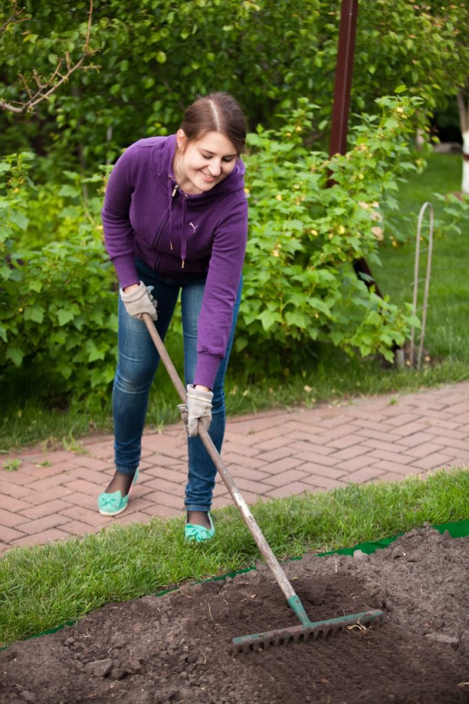 woman working on garden bed